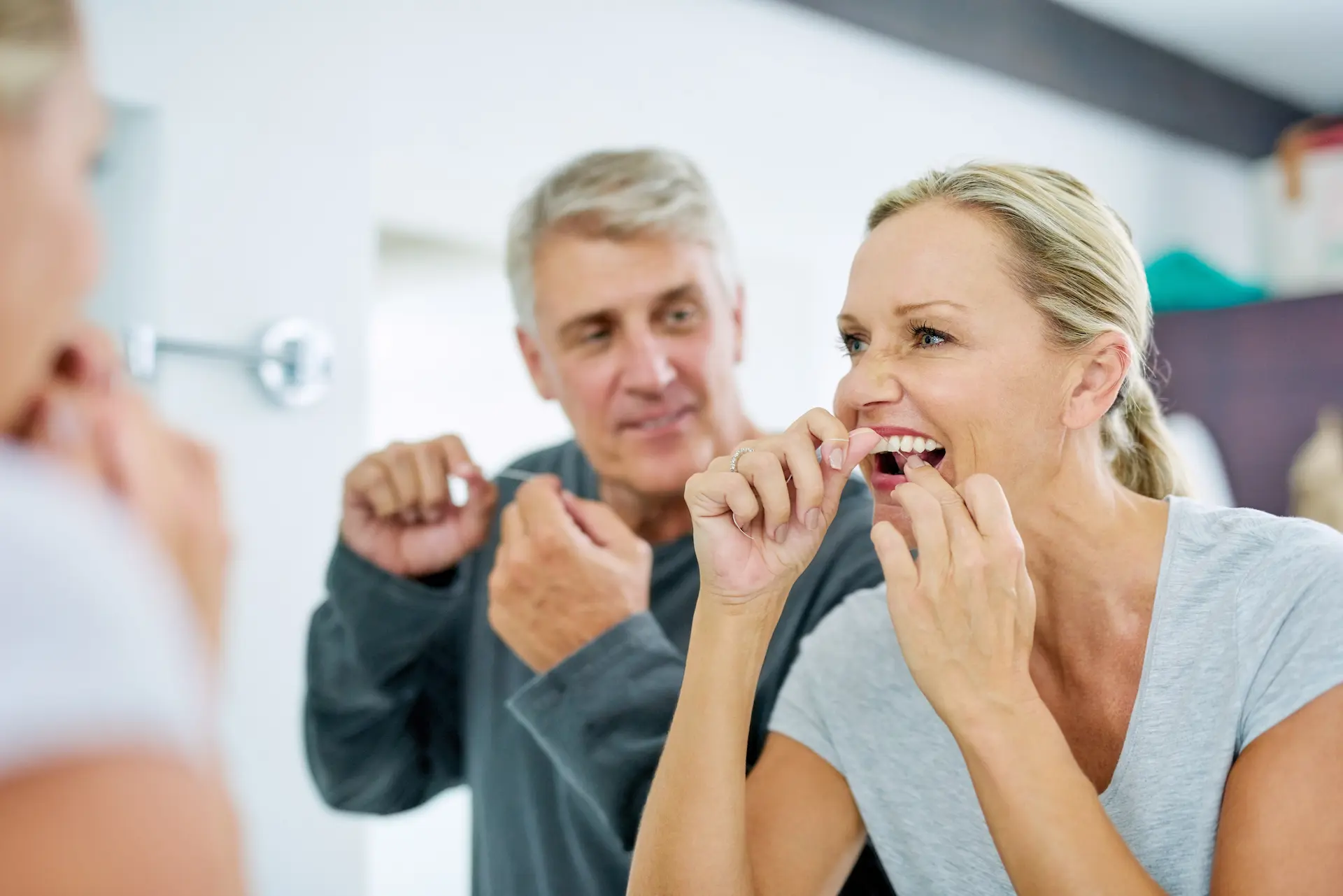couple flossing for healthy gums